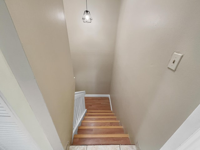 stairs with wood-type flooring