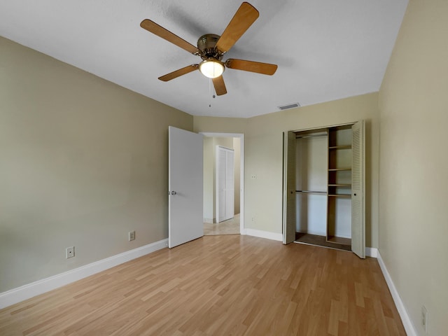 unfurnished bedroom with ceiling fan and light wood-type flooring