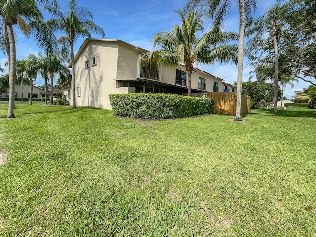 view of home's exterior featuring a lawn