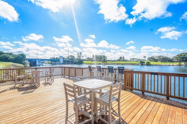 wooden deck featuring a water view