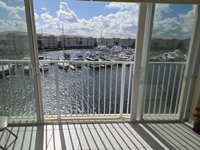 balcony featuring a water view