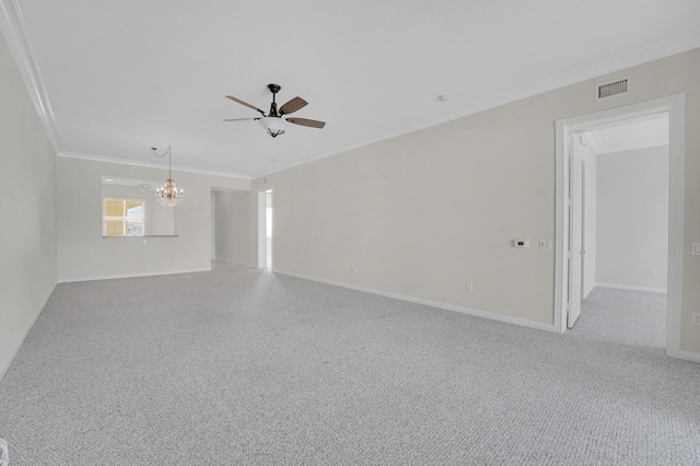 spare room with crown molding and ceiling fan with notable chandelier