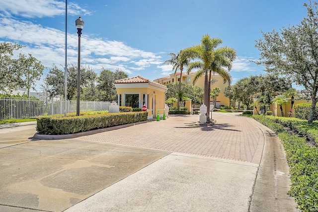 view of property's community featuring fence