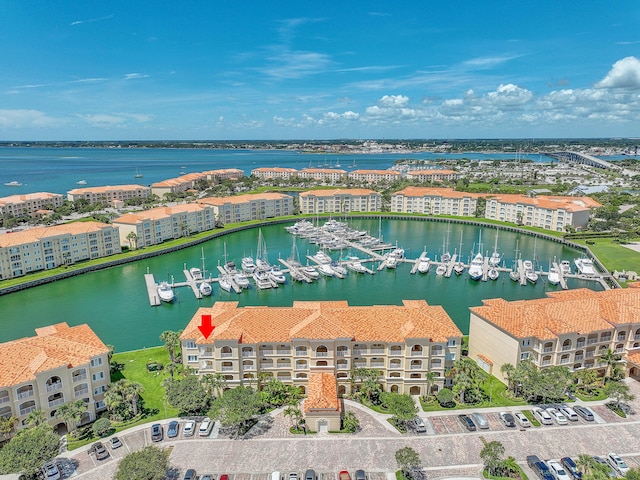birds eye view of property featuring a water view