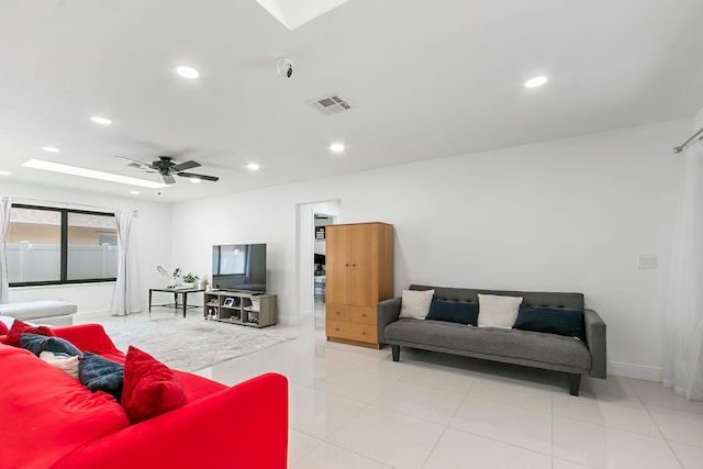 living room with ceiling fan and light tile patterned flooring