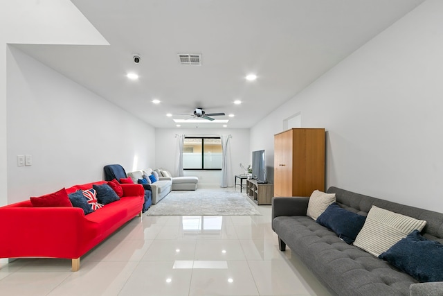 tiled living room featuring ceiling fan