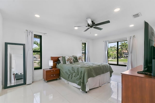 bedroom with light tile patterned floors and ceiling fan