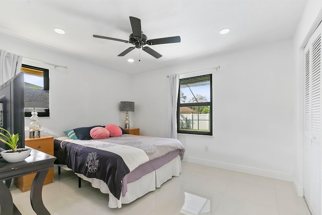 bedroom featuring ceiling fan and a closet