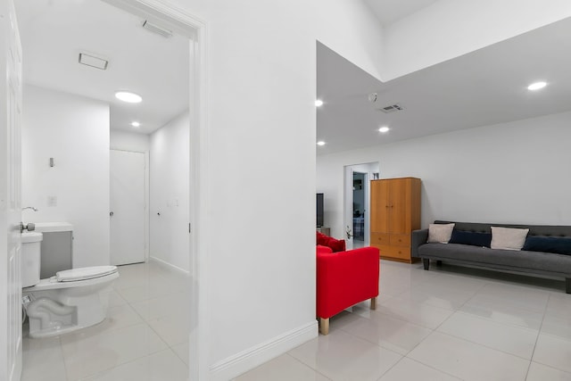 bathroom with toilet and tile patterned floors