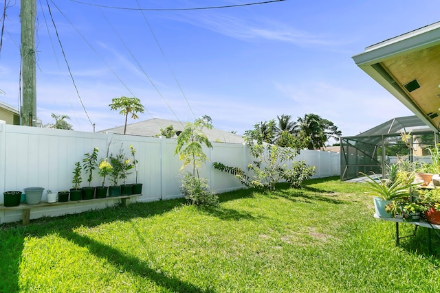 view of yard featuring a lanai