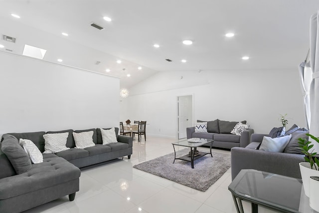 living room featuring light tile patterned flooring and lofted ceiling with skylight