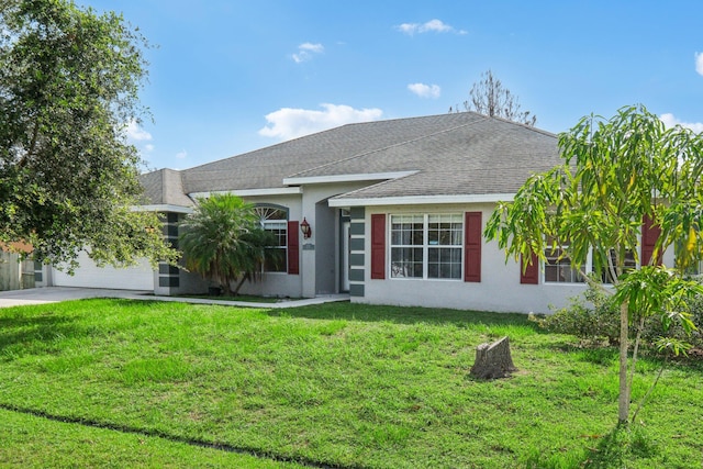 ranch-style home featuring a front yard and a garage