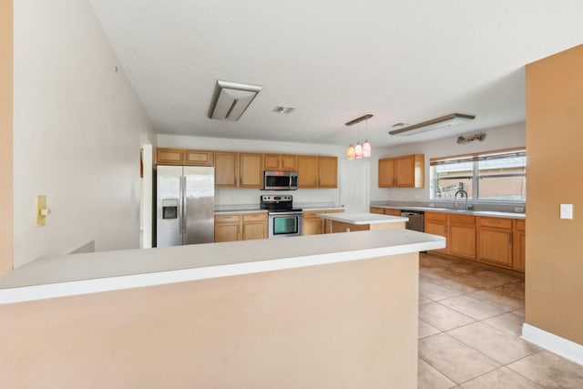 kitchen featuring a kitchen island, light tile floors, hanging light fixtures, sink, and appliances with stainless steel finishes