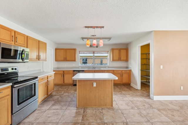 kitchen featuring stainless steel appliances, a center island, a textured ceiling, light tile floors, and pendant lighting