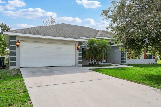 ranch-style home featuring a front lawn and a garage