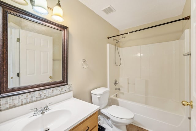 full bathroom with bathtub / shower combination, vanity, toilet, and backsplash