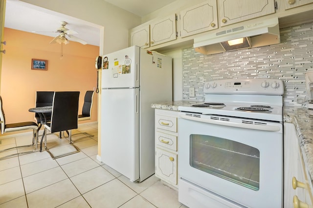 kitchen featuring decorative backsplash, light tile patterned floors, white appliances, and ceiling fan