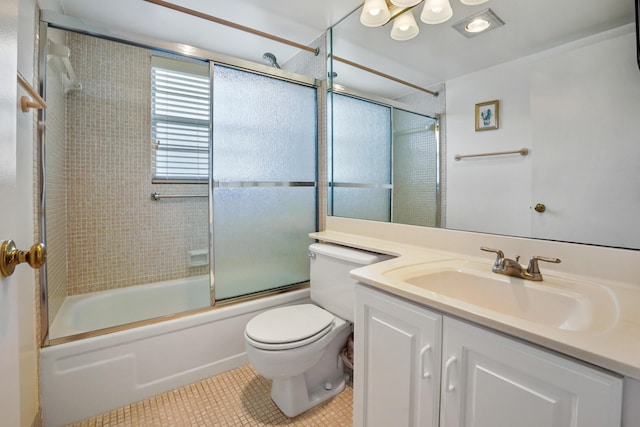 full bathroom featuring toilet, tile patterned flooring, vanity, and combined bath / shower with glass door