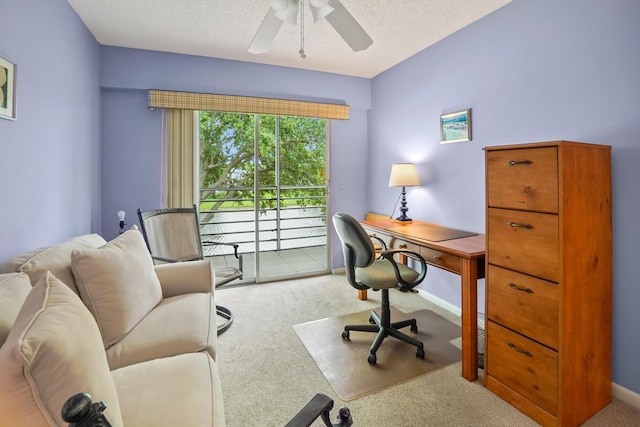 office with light carpet, a textured ceiling, and ceiling fan