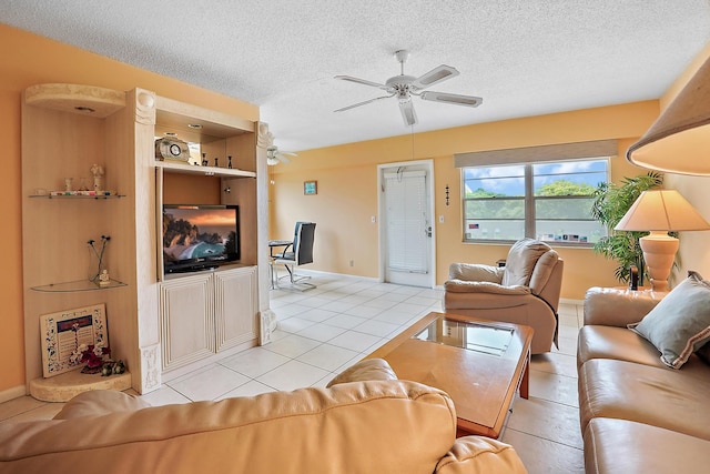 tiled living room with ceiling fan and a textured ceiling