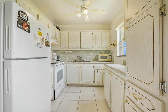 kitchen with backsplash, white appliances, ceiling fan, sink, and light tile patterned floors