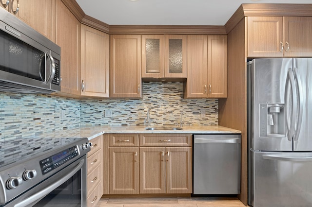 kitchen featuring sink, tasteful backsplash, and stainless steel appliances