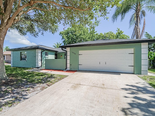 view of front facade with a garage and a front yard