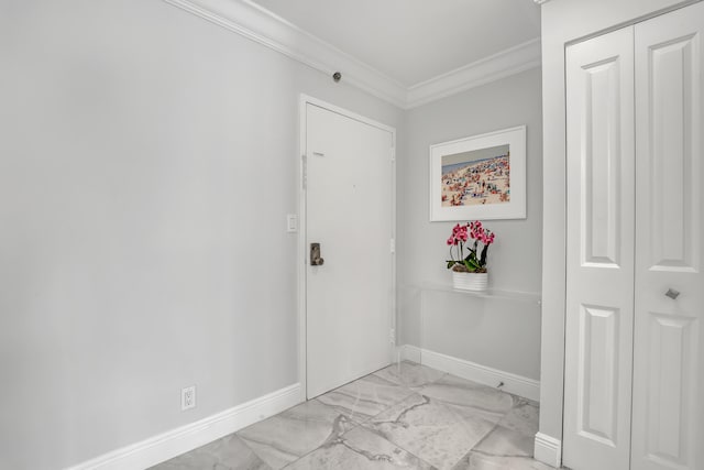 entrance foyer featuring ornamental molding and light tile patterned floors