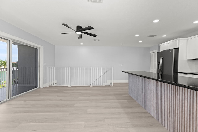 kitchen featuring ceiling fan, light hardwood / wood-style flooring, stainless steel refrigerator with ice dispenser, and white cabinetry