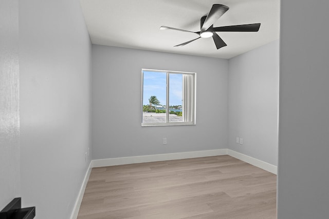 spare room with light hardwood / wood-style floors and ceiling fan