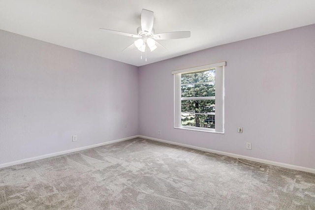 empty room featuring ceiling fan and carpet floors