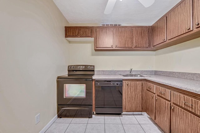 kitchen with ceiling fan, sink, light tile patterned floors, and black appliances