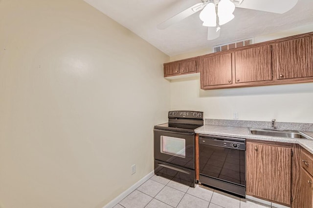 kitchen featuring vaulted ceiling, ceiling fan, sink, black appliances, and light tile patterned floors