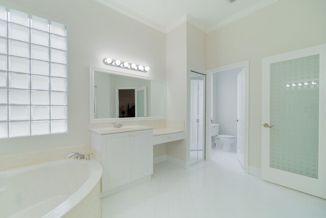 bathroom with a bathing tub, oversized vanity, toilet, tile floors, and ornamental molding