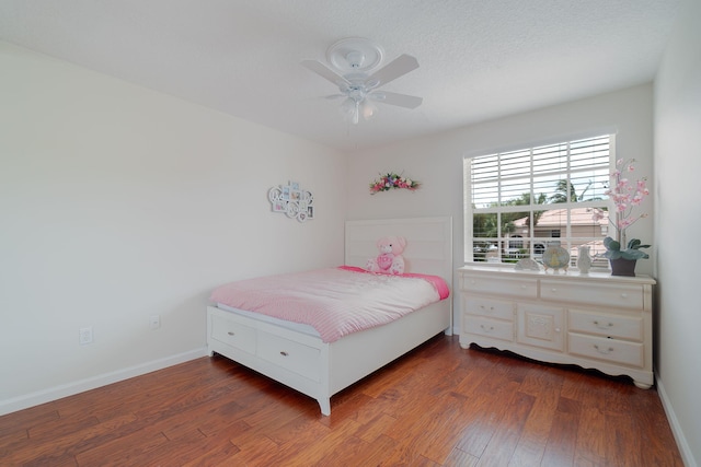 bedroom featuring hardwood / wood-style floors and ceiling fan