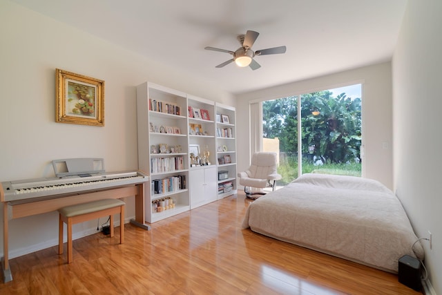 bedroom featuring ceiling fan and light hardwood / wood-style flooring