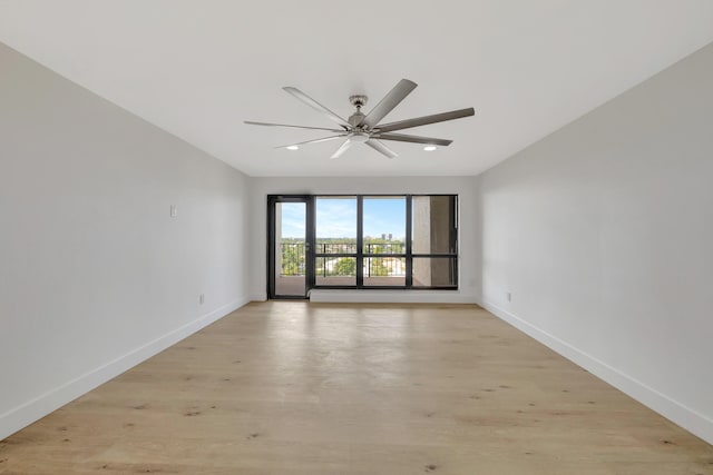 unfurnished room featuring light hardwood / wood-style flooring and ceiling fan