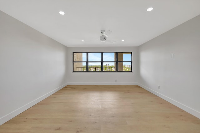 empty room featuring light hardwood / wood-style flooring and ceiling fan