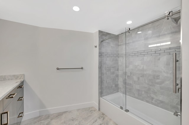 bathroom with combined bath / shower with glass door, tile patterned floors, and vanity