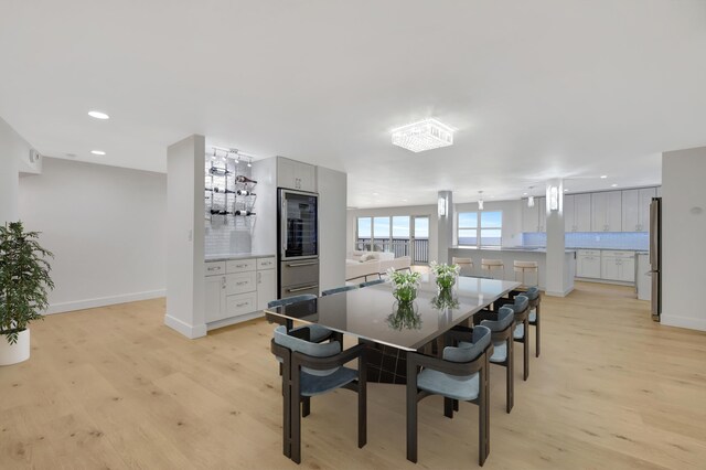 dining area with light hardwood / wood-style floors