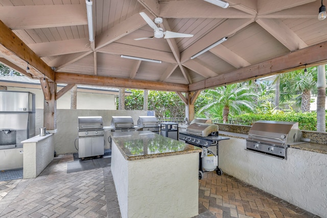 view of patio / terrace with area for grilling, ceiling fan, a grill, and a gazebo