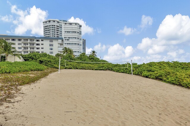 view of home's community featuring volleyball court