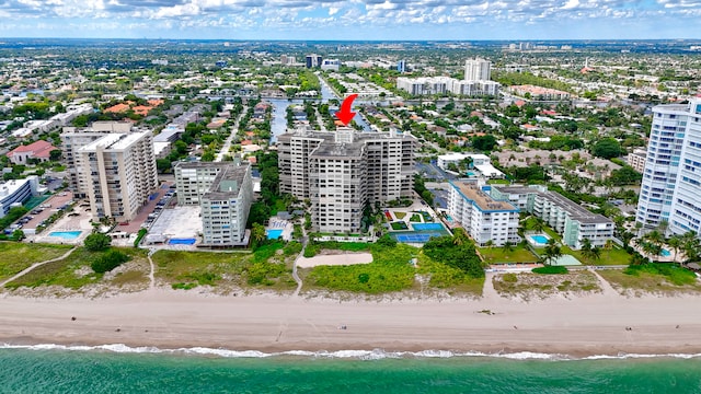 aerial view with a view of the beach and a water view