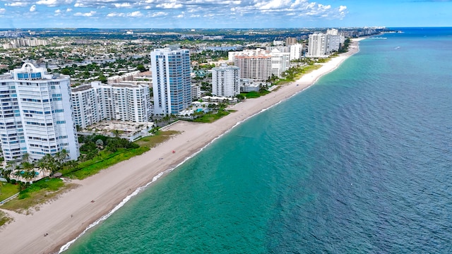 bird's eye view featuring a water view and a view of the beach