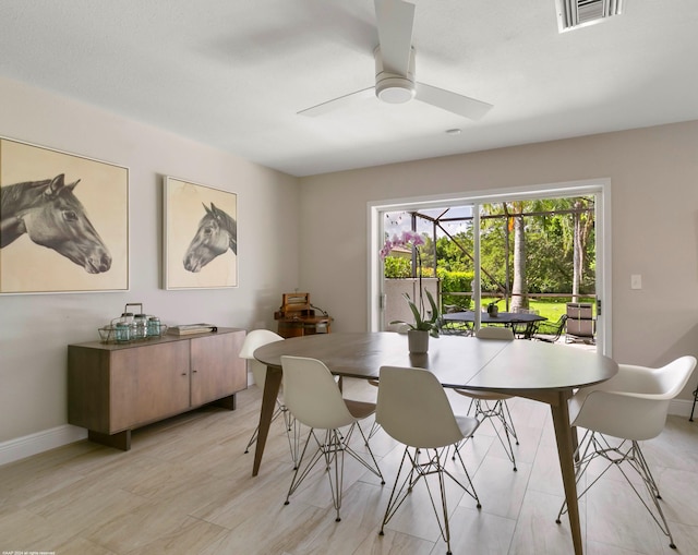 dining space featuring a ceiling fan, visible vents, and baseboards