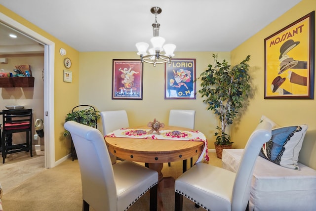 carpeted dining space featuring a chandelier