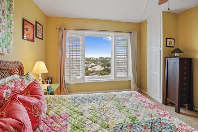 carpeted bedroom with ceiling fan