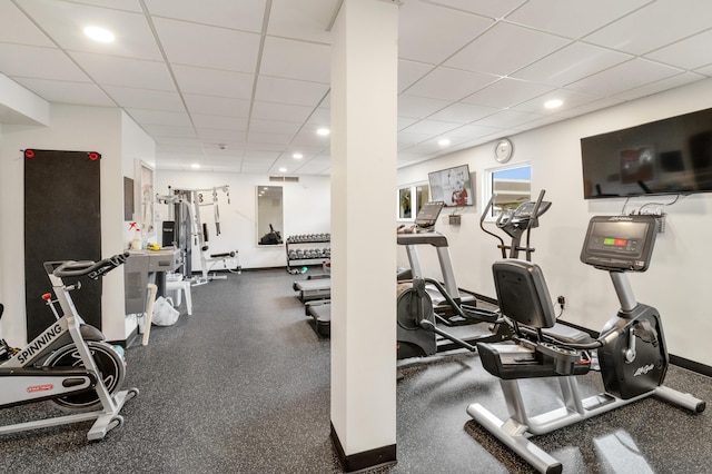 gym featuring a drop ceiling