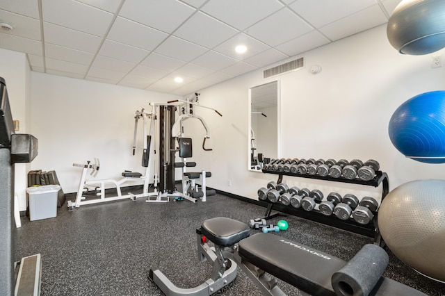 gym featuring a paneled ceiling