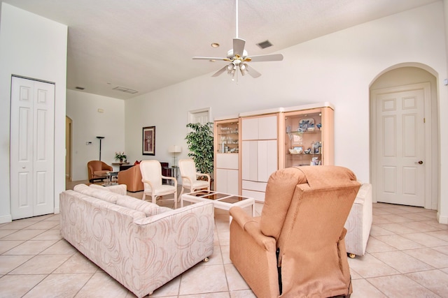 living room with ceiling fan and light tile patterned floors